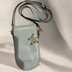 NWOT Light Blue Crossbody Bag with bag charm
